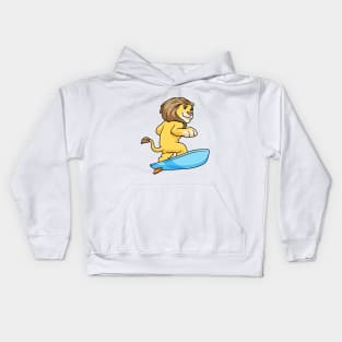 Lion as surfer on a surfboard Kids Hoodie